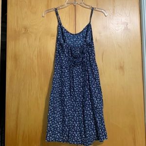 An XS Hollister dress with flower pattern on the dress.
